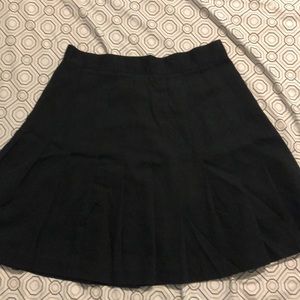 Pleated black skirt.